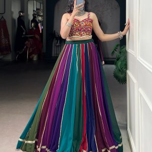 (Stitched) lehenga Choli features real mirror Gamthi work on the blouse paired with a multi-shaded flair skirt